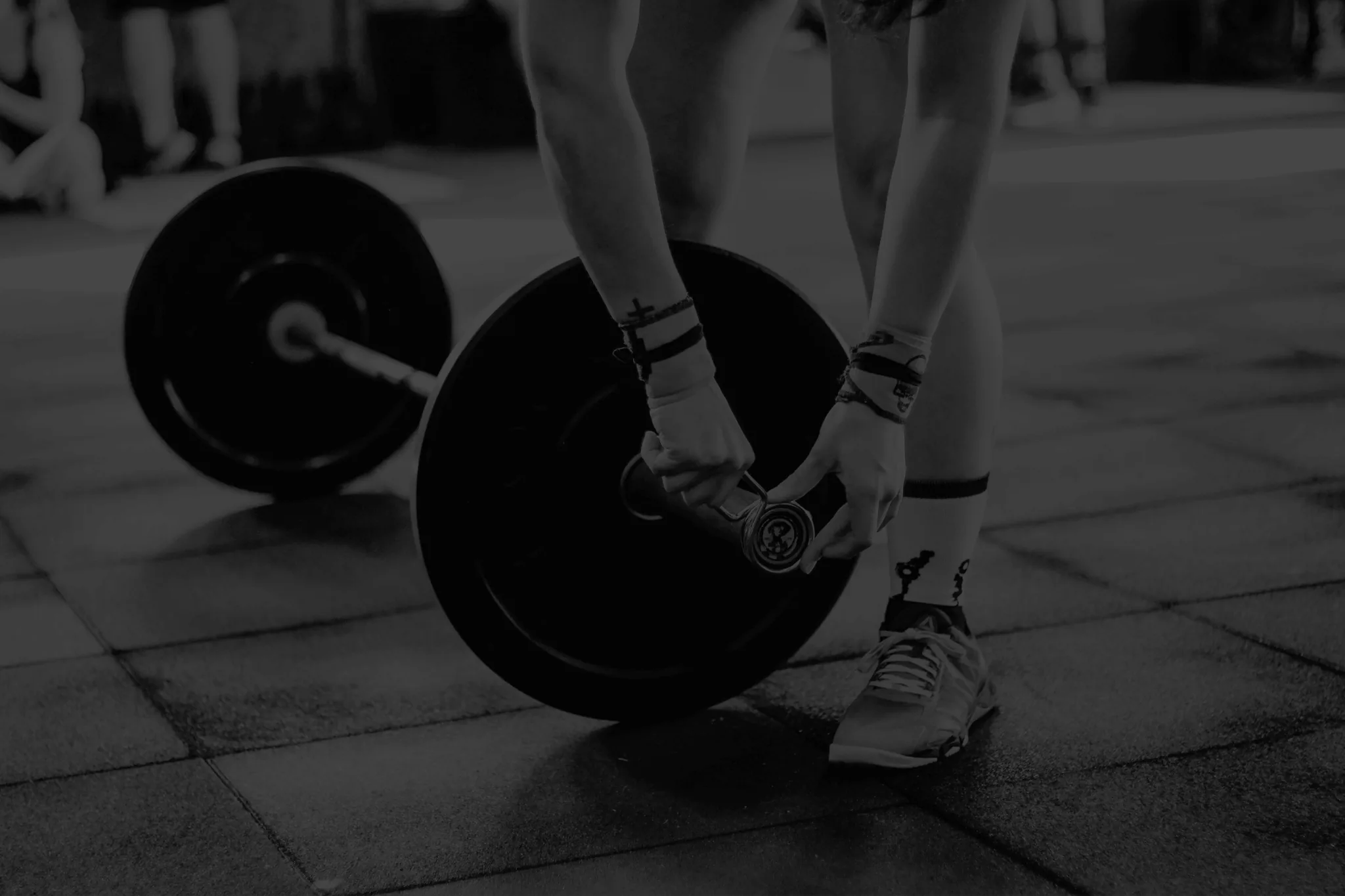 Athlete mid-workout with a barbell